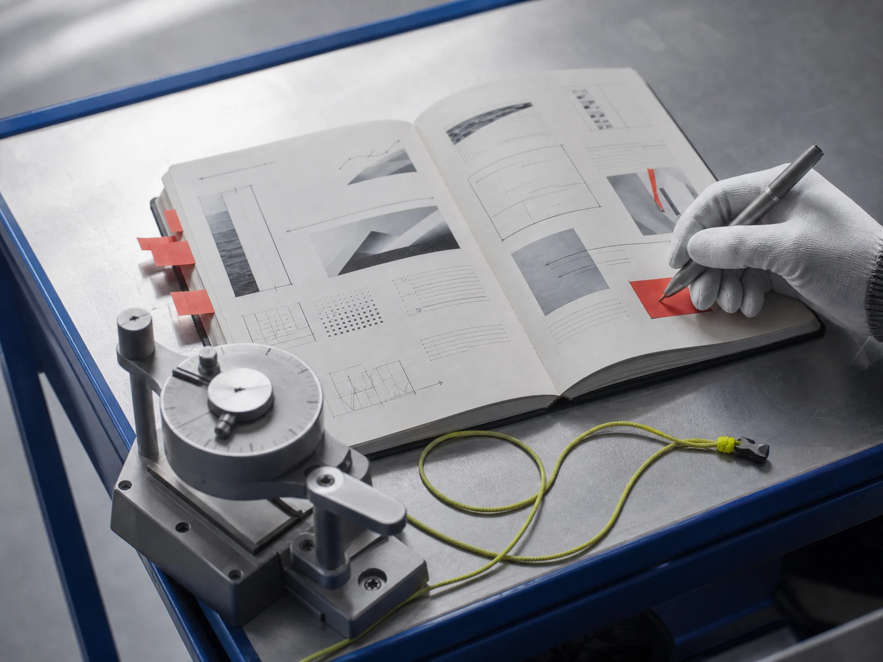 Annotated campaign test brief beside a compact measurement instrument